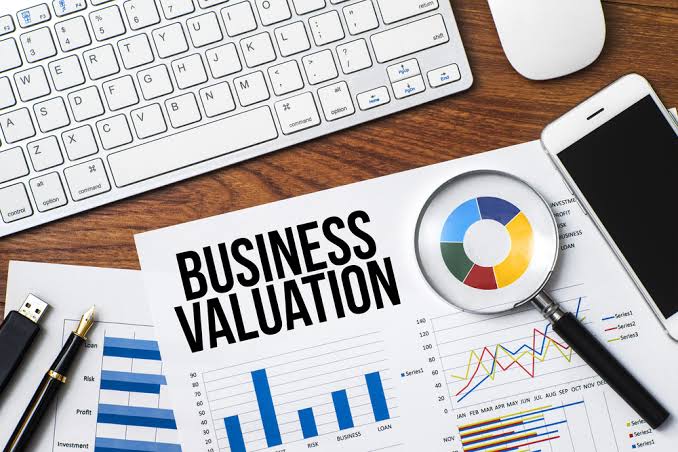 Business valuation, what is my business worth, business valuation papers and keyboard