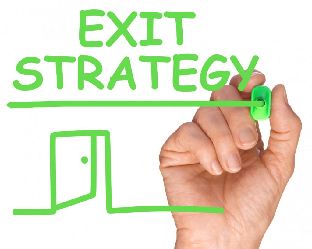 Exit strategies, hand writing exit strategy in green marker