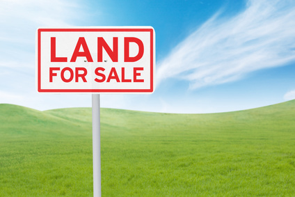 bright-line test taxes, land for sale sign on green grass