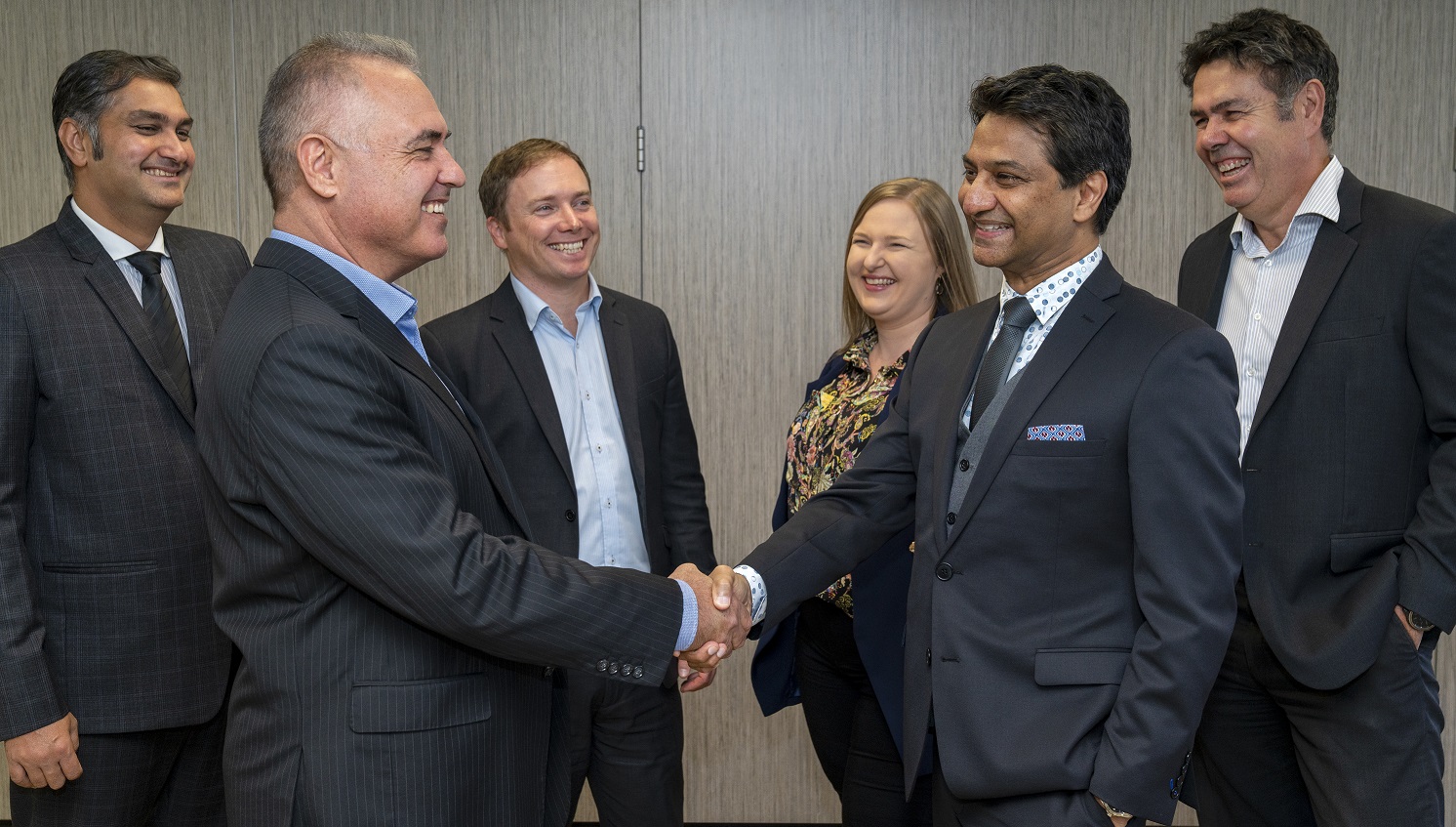 Grant and Sungesh handshake New UHY Managing Director, Grant Brownlee, Sungesh Singh